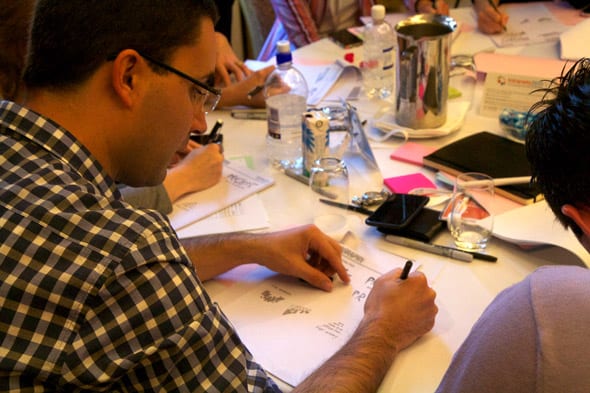 A student practices basic typography during a sketching workshop