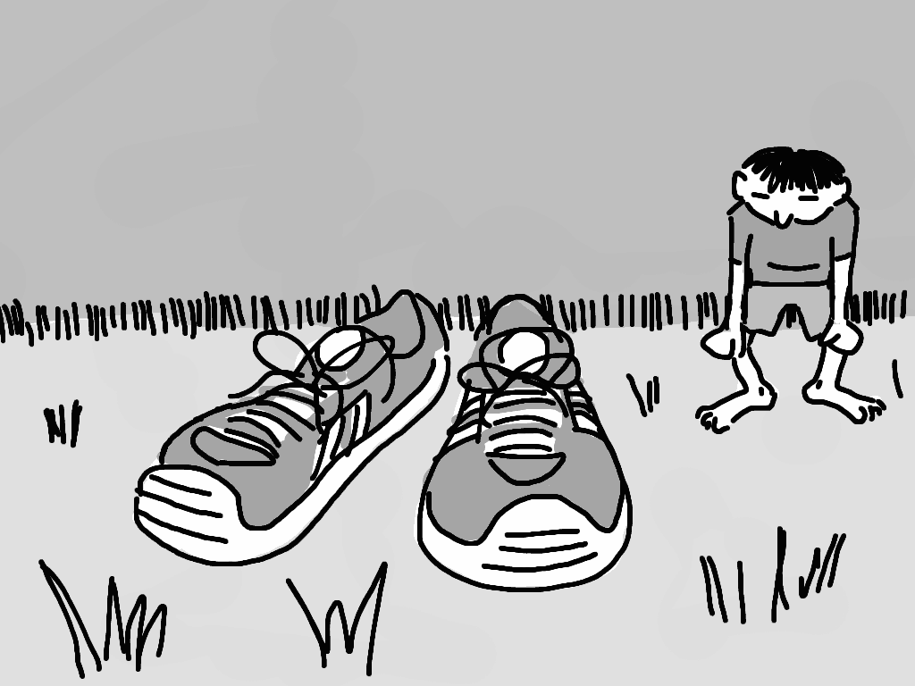 A pair of shoes in the foreground, with someone catching their breath in the background
