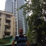 Luke standing in front of a building in KL