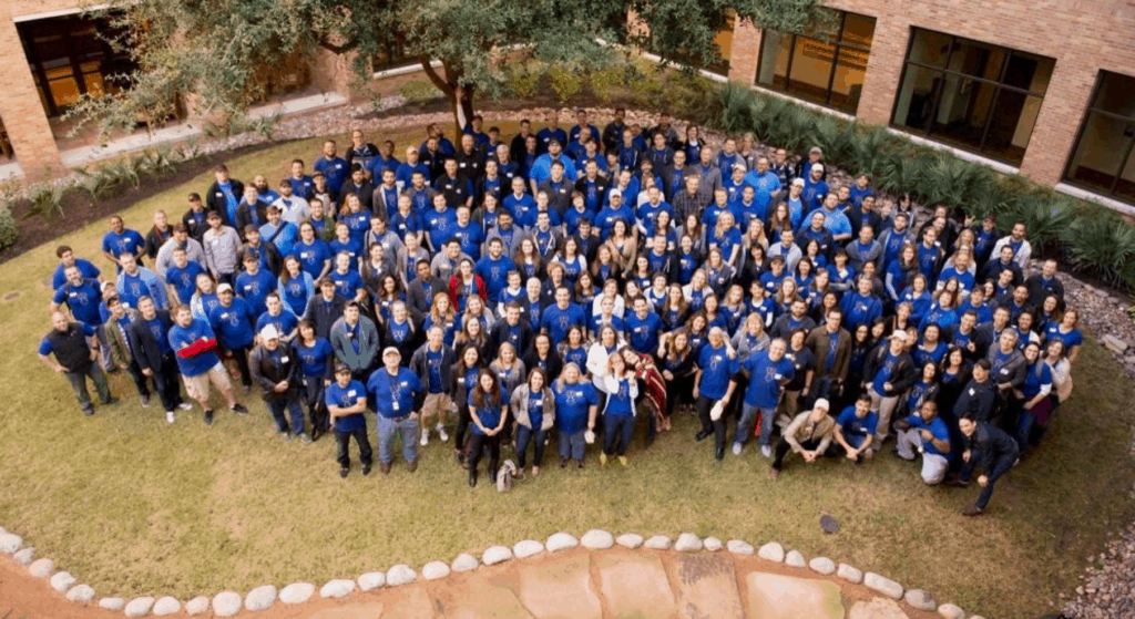 An aerial photo of the Kasasa team standing on the lawn